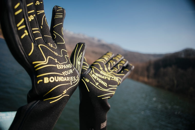 Swim gloves neoprene being used for an open water swimming swim.