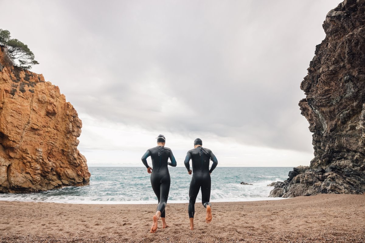 Open water swimmers about to sea swim in their Orca Athlex flex wetsuits
