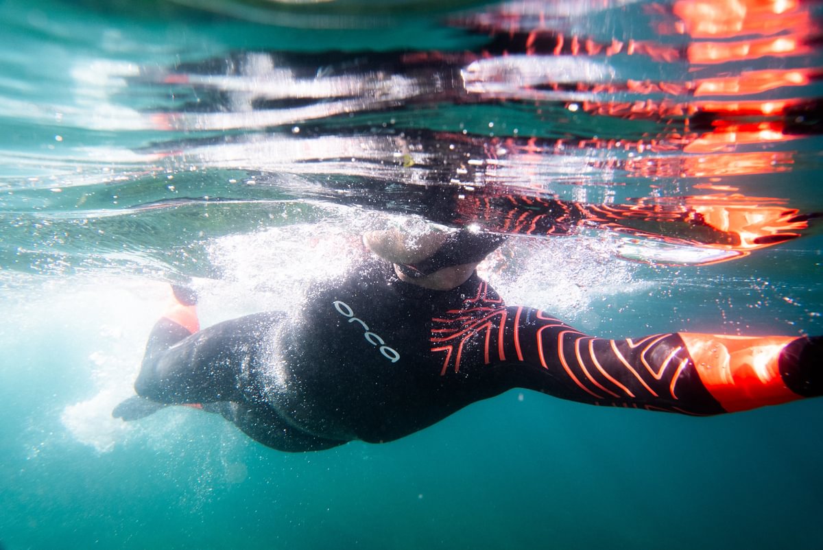Open water swimmer wearing the Orca Zeal Hi Vis wetsuit.