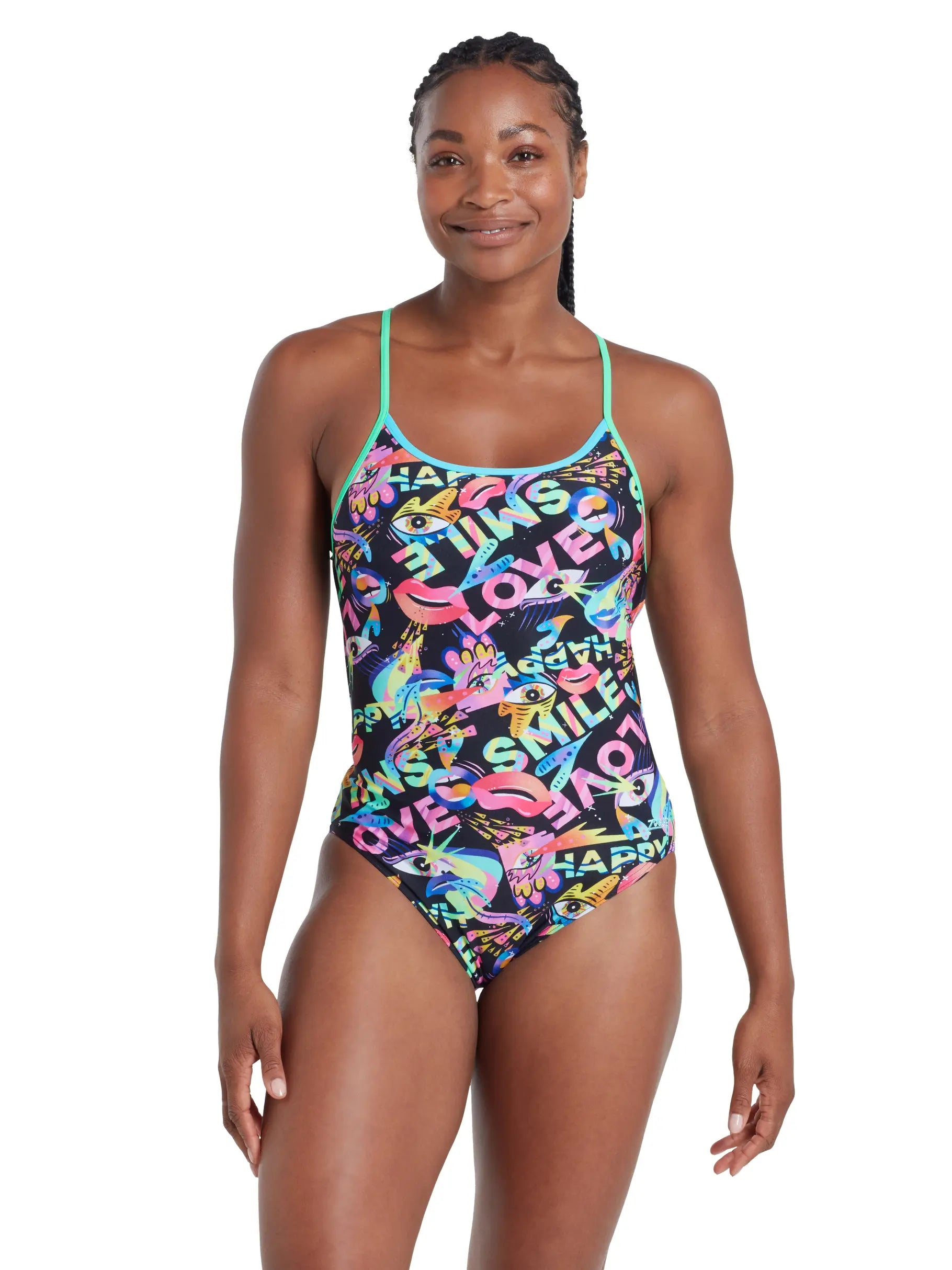 Woman wearing a colourfull Zoggs swimsuit with text and graphics on a white background.