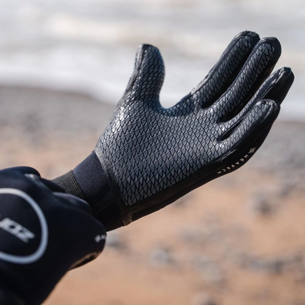Pair of Zone3 3.5mm Heat-Tech neoprene gloves providing warmth, flexibility, and waterproof protection for winter swims