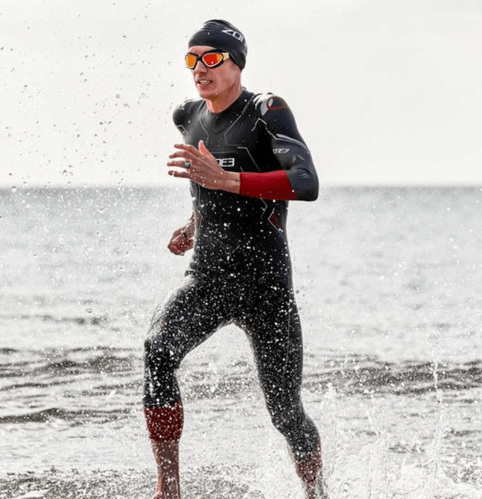 Triathlete leaving the water