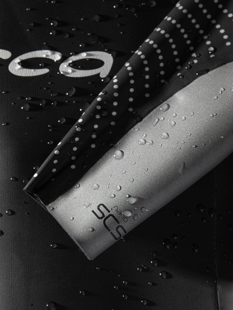 Mens Orca Apex Flow wetsuit quick transition cuffs with water droplets. 