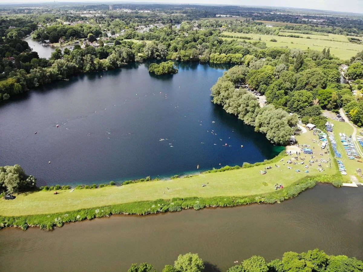 Image of shepperton open water swim nestled alongside the river thames. 