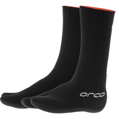 Black neoprene socks with red lining on a transparent background, featuring the Orca brand for winter swimming. 