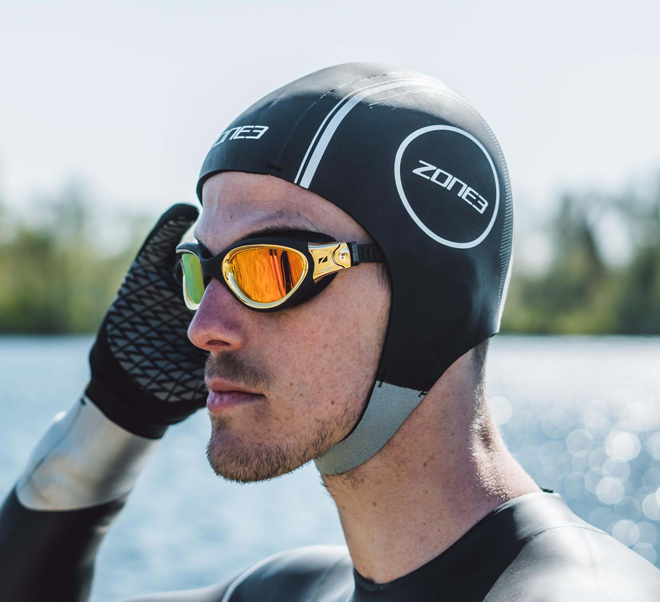 Zone3 Neoprene Heat-Tech Warm Swim Cap, low-drag thermal cap with hook-and-loop chin strap for cold weather swimming.